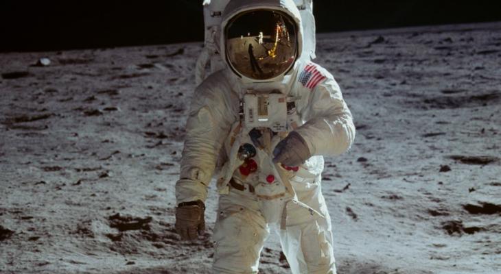 Person in spacesuit walking on the moon