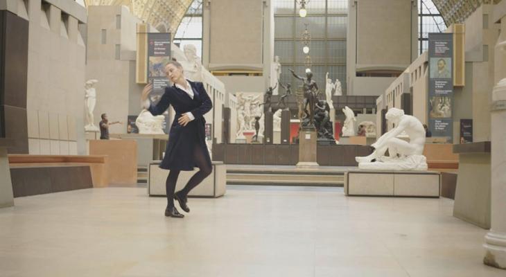 Person dancing in a museum