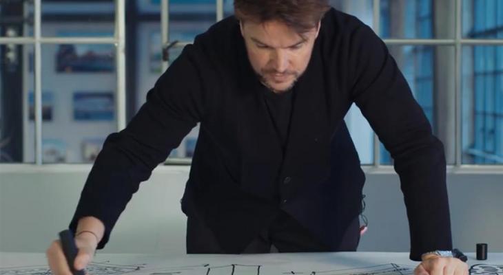 Bjarke Ingels looking at building design plans