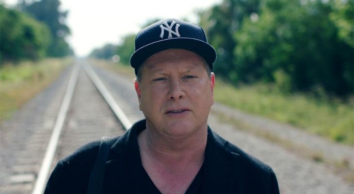 Person walking along railroad tracks