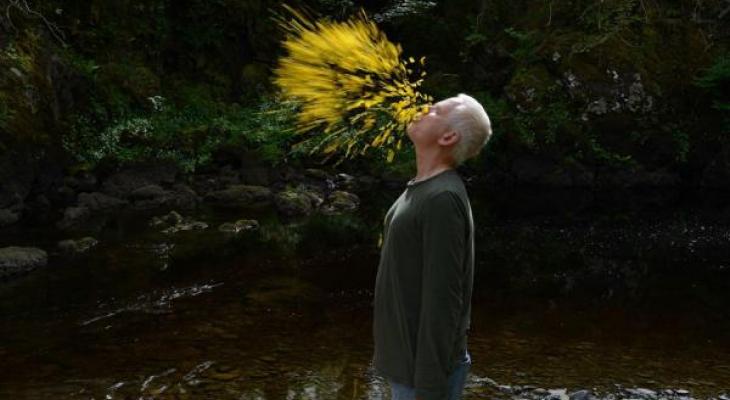 man spitting yellow