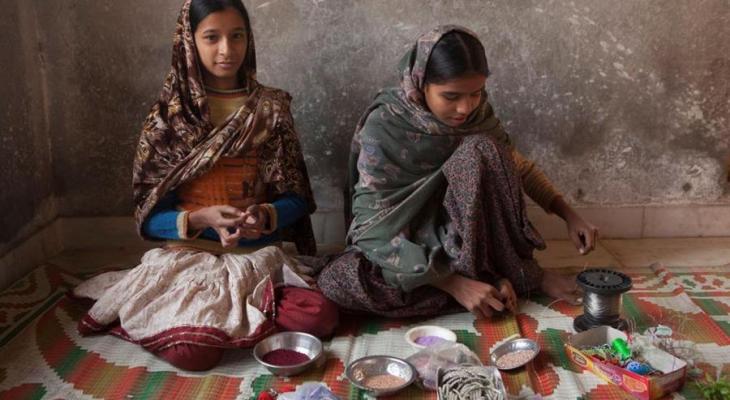 Two women sitting in Hapur, outside of Delhi.