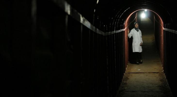 Person standing in a tunnel