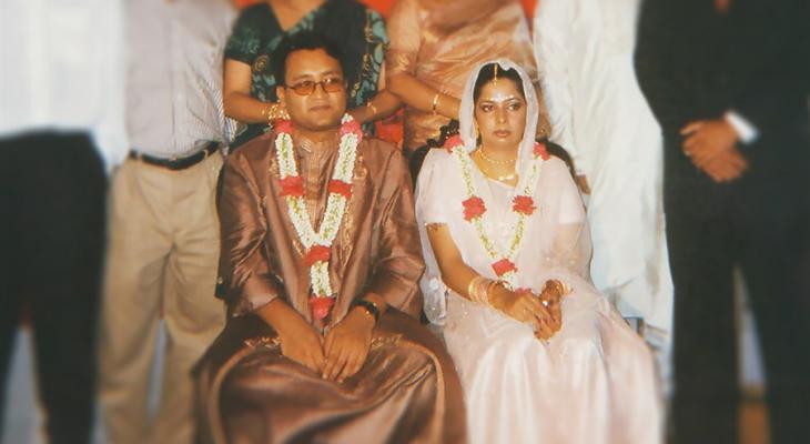 Two people sitting next each other at a wedding