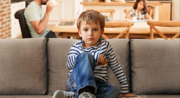 child sitting on couch