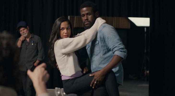 Actors take direction on a film set.