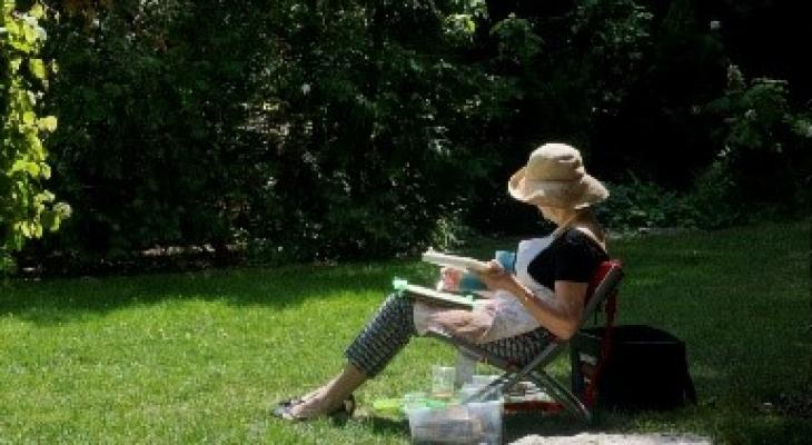 Woman sitting on the chair in garden