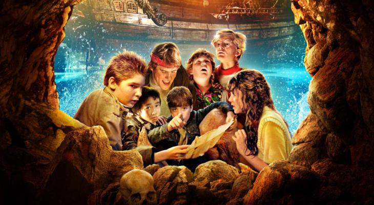 The Goonies look at their treasure map.