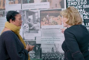 2 people looking at art