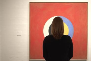 Person looking at a painting
