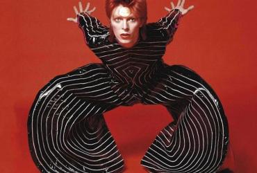 David Bowie in a striped pant suit