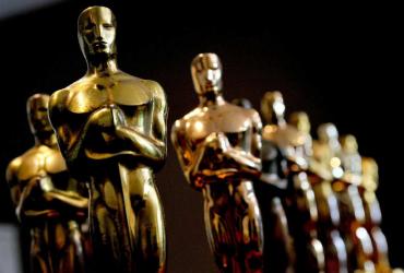 A series of Oscar statuettes.