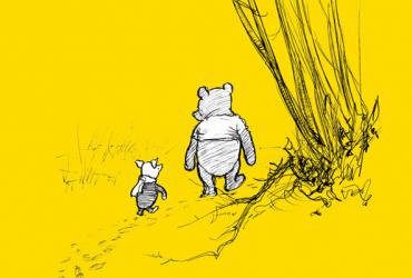 Winnie and Piglet walking on a trail