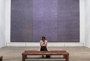 Woman staring at a painting