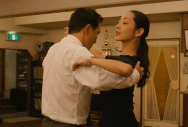 a man and woman dancing together