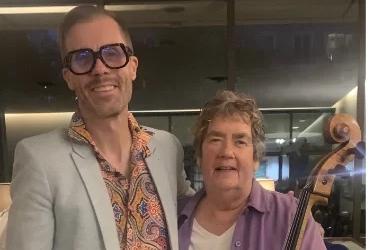 Picture of two musicians, one with guitar and one with cello, with text "Women's Art Association of Canada FUNDRAISING CONCERT, Friday, November 17, 2023 DIGNAM GALLERY" on the right side