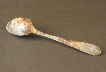 a rusted tarnished spoon