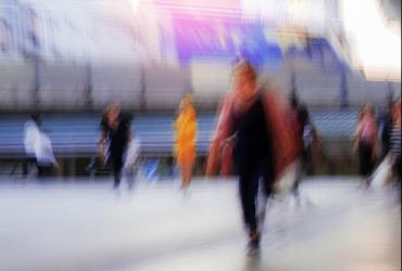 blurred image of people walking