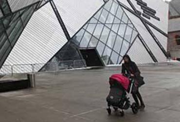 A women walks by the Royal Ontario Museum on Bloor St. Near University Ave. in Toronto. Photo: Brett Gundlock/National Post.