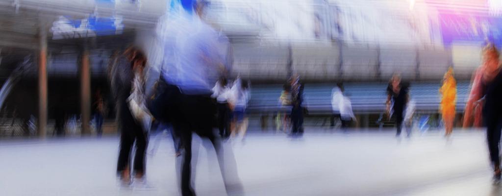 blurred image of people walking